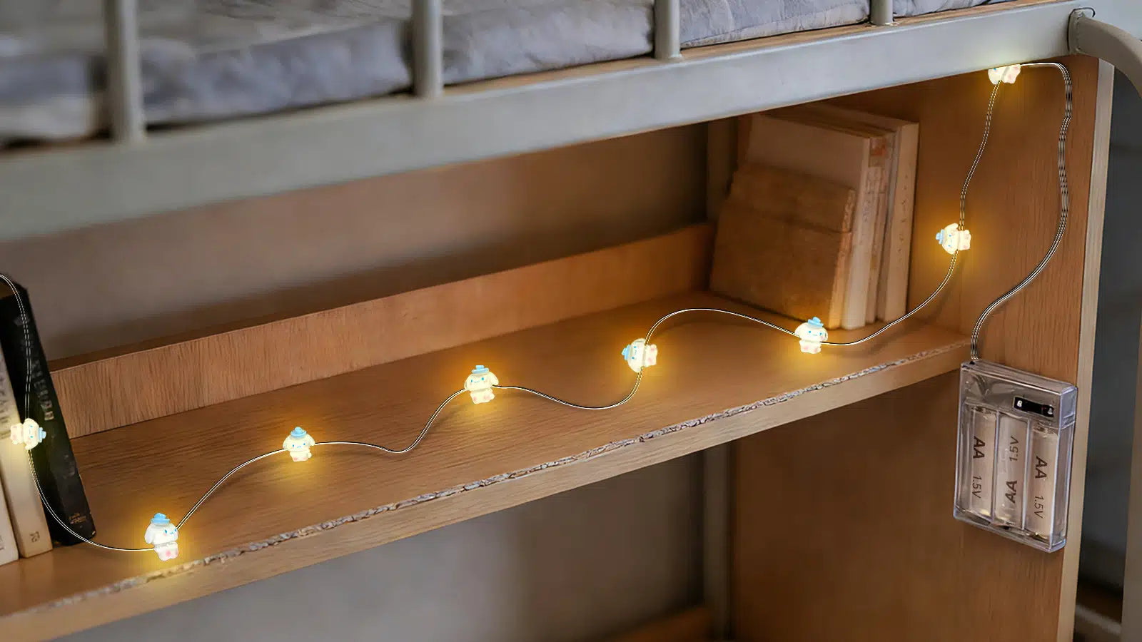 Dorm room fairy lights on shelf, warm glow for cozy small spaces.