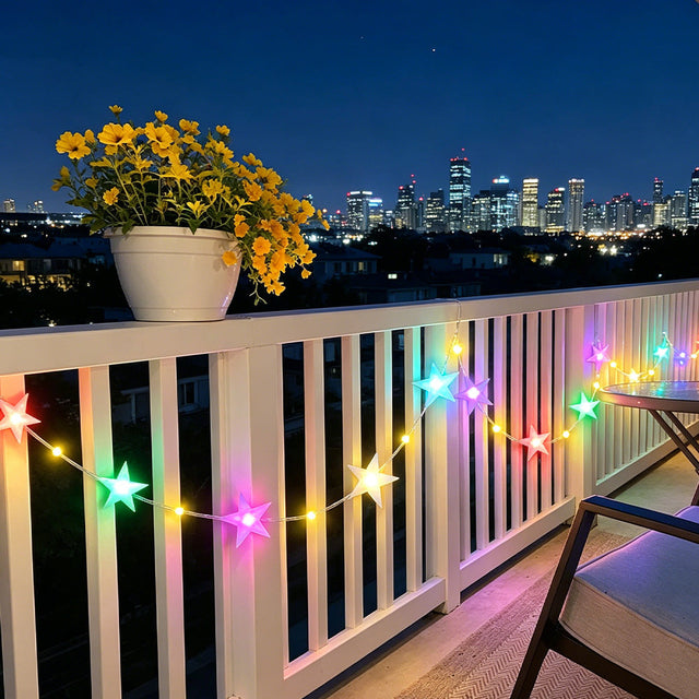 Jcfyoo RGB star string lights glowing in multicolor on outdoor balcony railing at night with city skyline in background