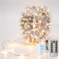 Silver-wire copper fairy lights on a reel with warm-white LEDs, USB controller, remote and power adapter