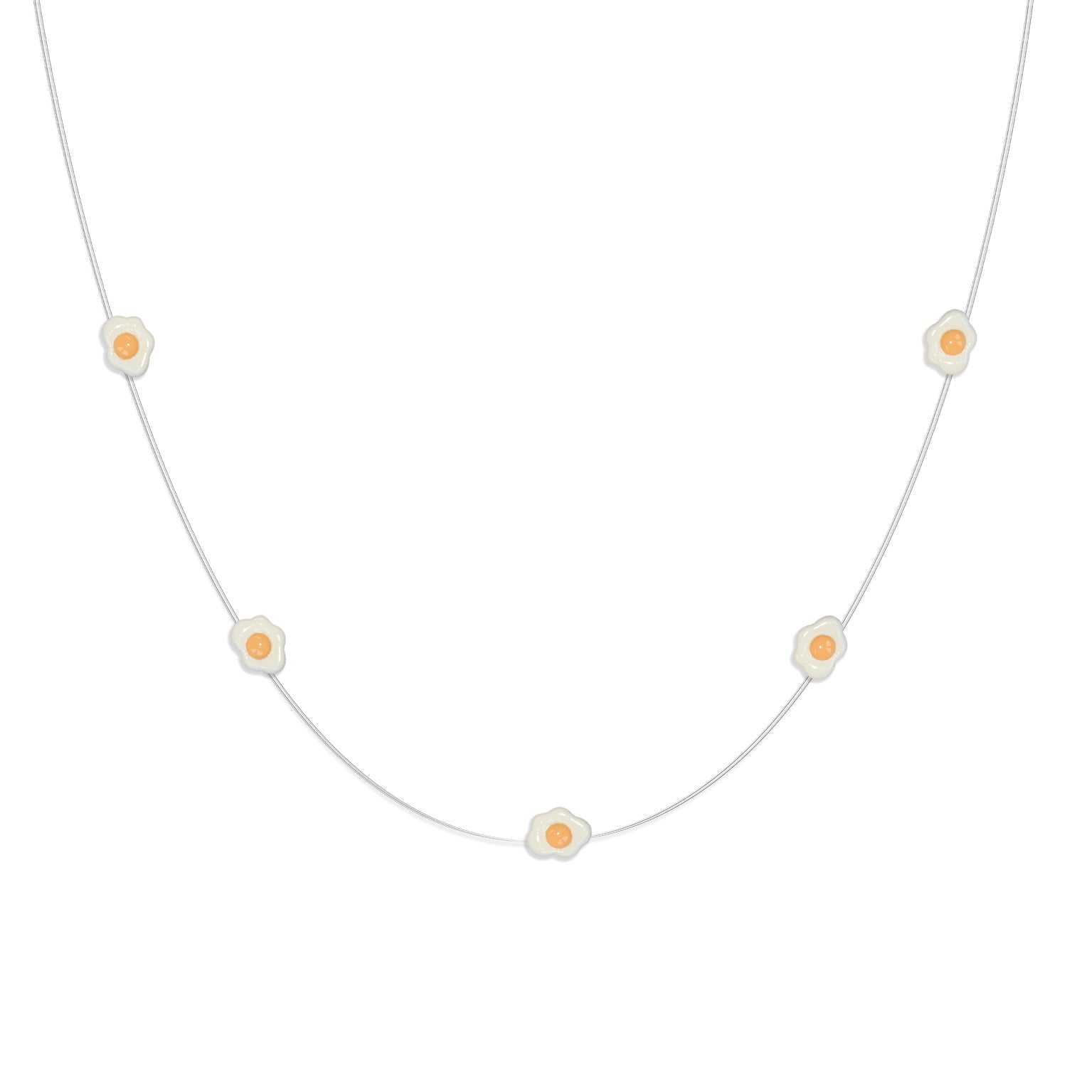 Close-up of Fried Egg LED decorations on flexible copper wire