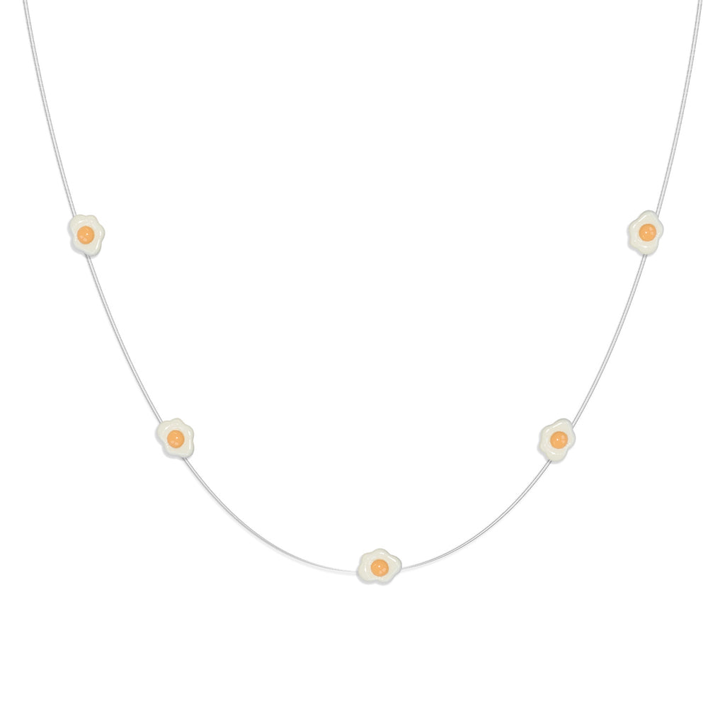 Close-up of Fried Egg LED decorations on flexible copper wire