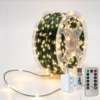 Green-wire copper fairy lights on a reel with warm-white LEDs, USB controller, remote and power adapter