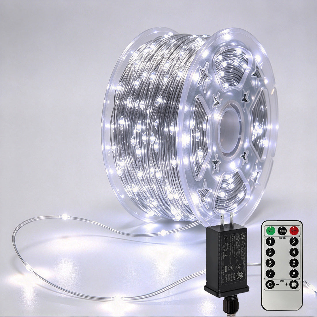 Silver-wire copper fairy lights on a reel with crisp-white LEDs, power adapter and remote