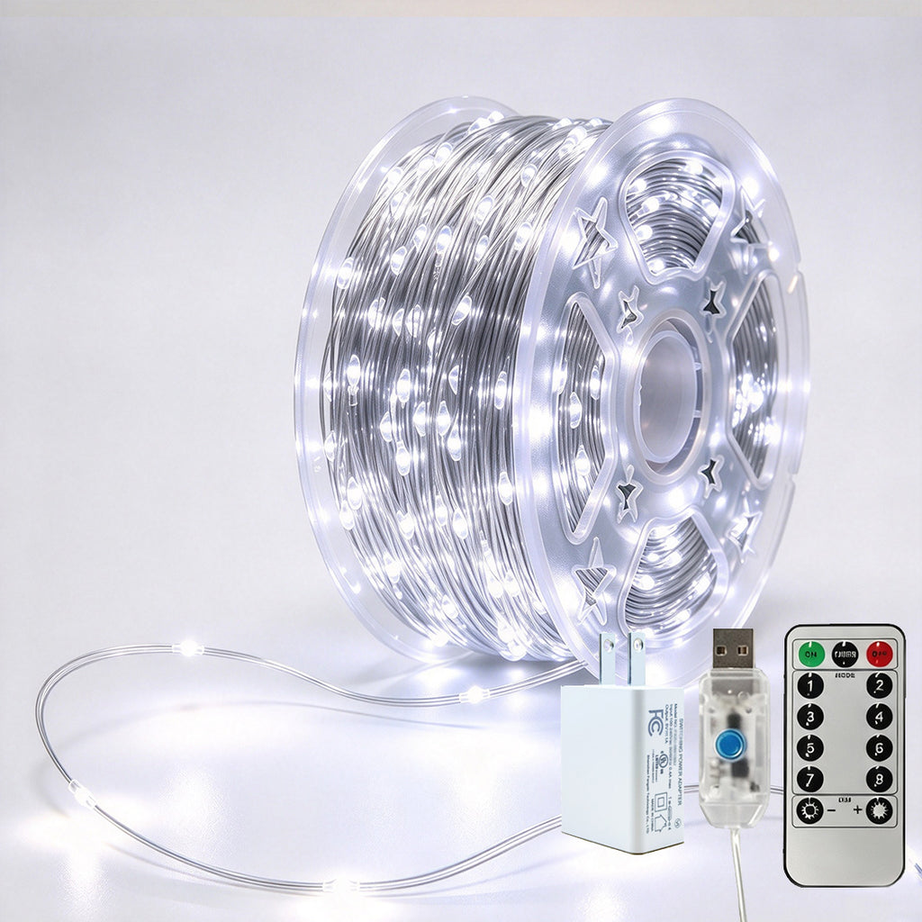 Silver-wire copper fairy lights on a reel with crisp-white LEDs, USB controller, remote and power adapter