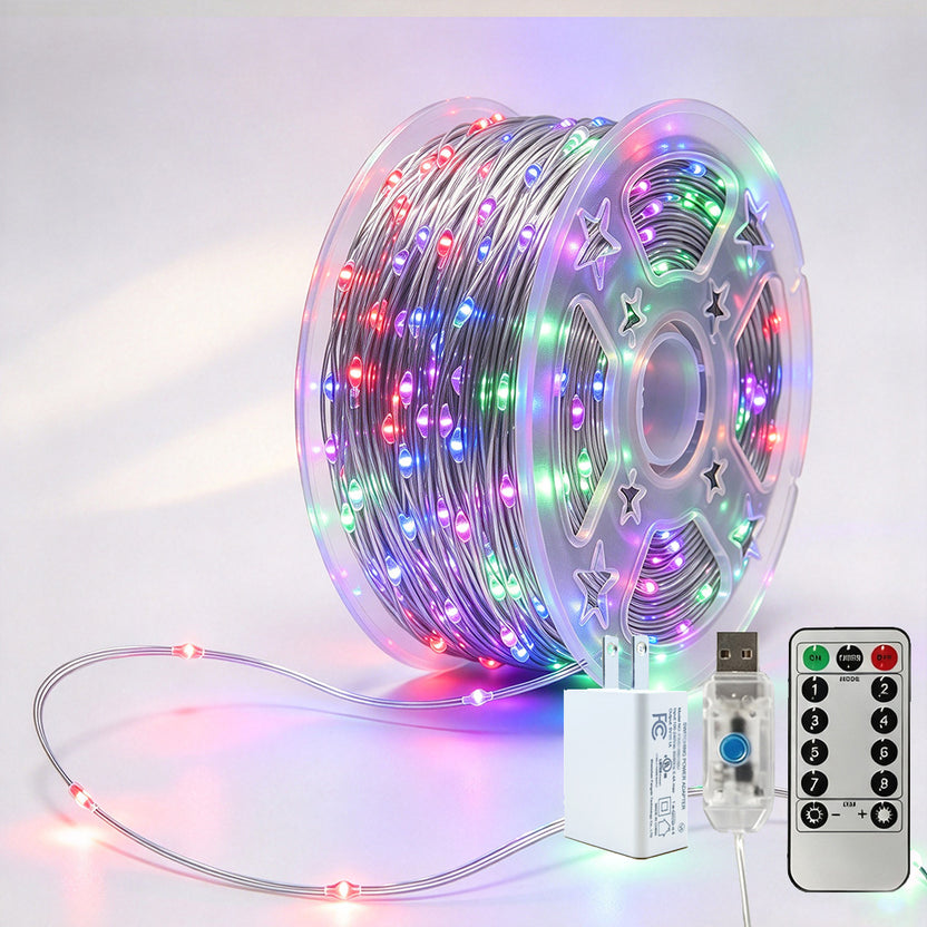 Silver-wire copper fairy lights on a reel with multicolor LEDs, USB controller, remote and power adapter
