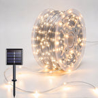 Silver-wire copper fairy lights on a reel with warm-white LEDs and a solar panel